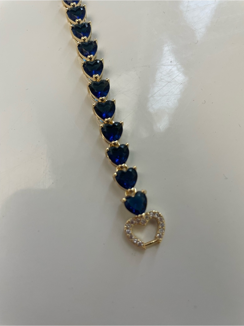 Gold tone Bracelet with Blue Heart Stones